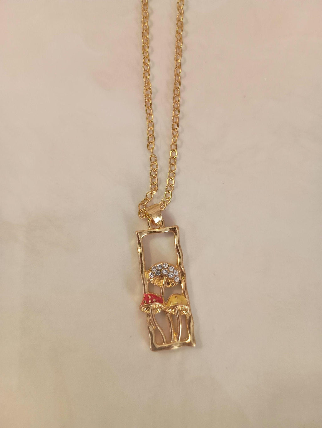 Gold rectangle mushroom necklace. Fairy garden. Whimsical red yellow.
