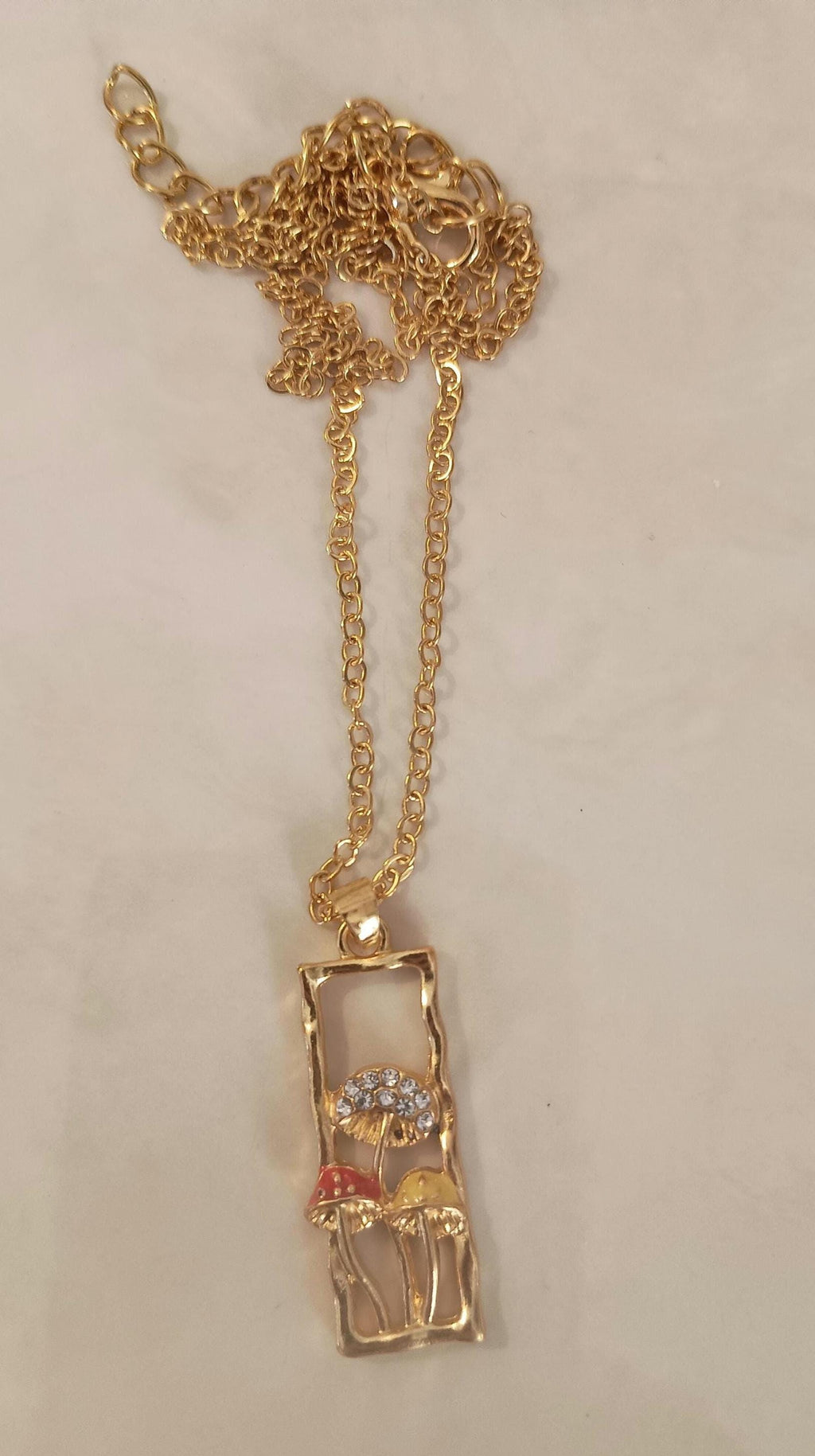 Gold rectangle mushroom necklace. Fairy garden. Whimsical red yellow.